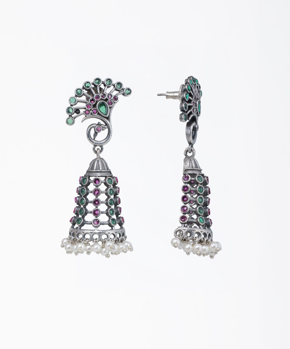 Decorative earrings with gemstones on a white background