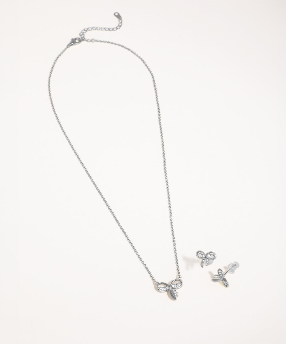 Silver necklace and earrings set on a white background