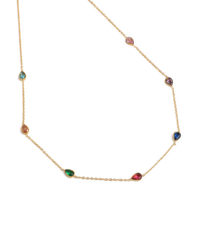 Gold necklace with multicolored gemstones on a white background