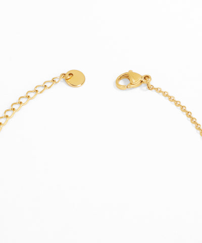 Gold bracelet with clasp on a white background