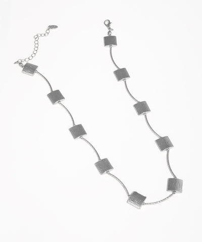 Silver necklace with square pendants on a white background