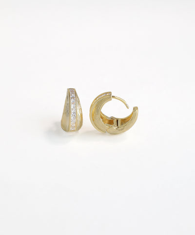 Gold hoop earrings with embedded stones on a white background