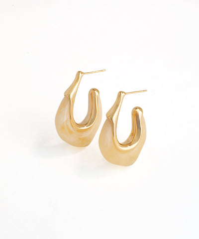 Gold hoop earrings on a white background