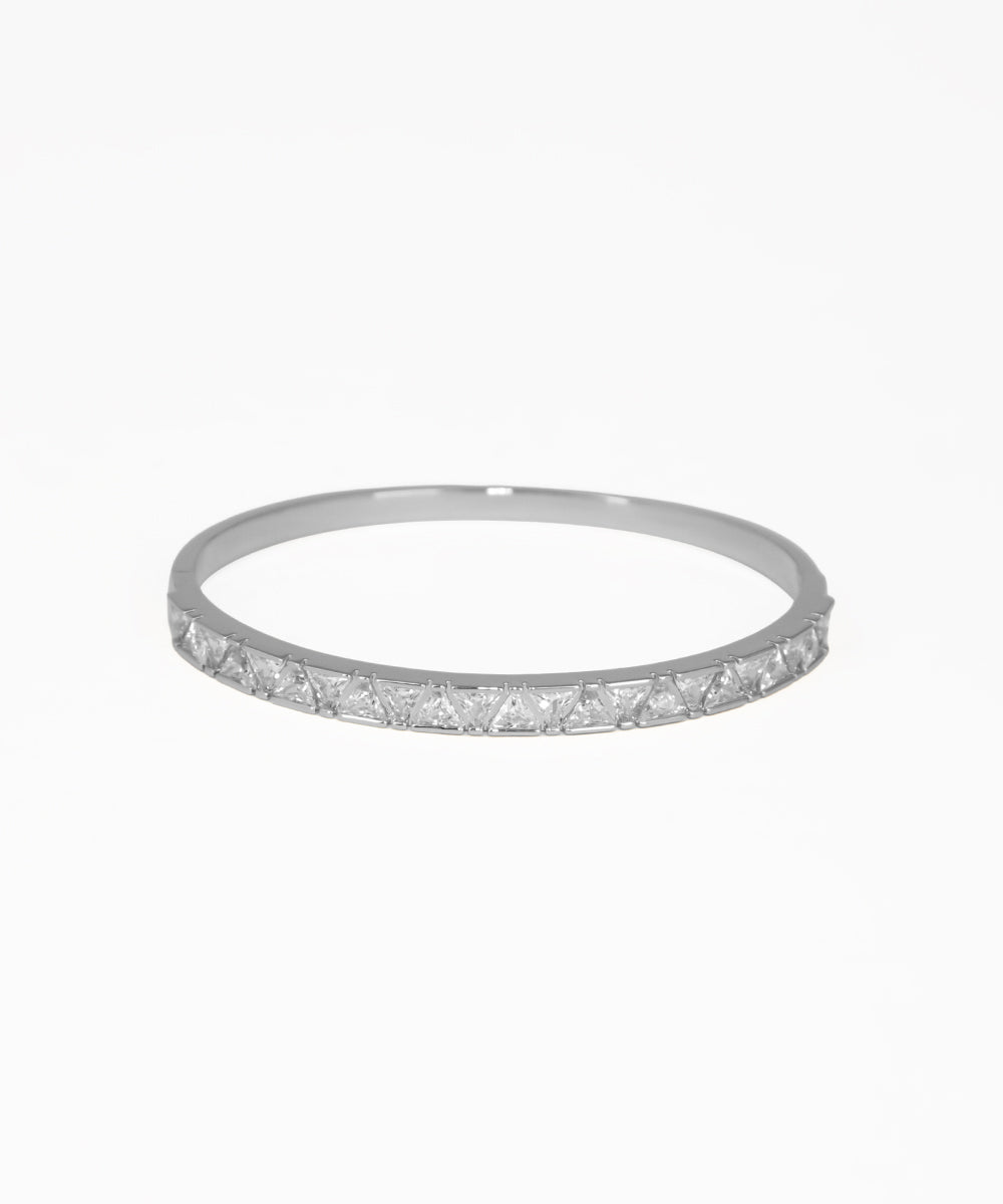 Silver bracelet with small stones on a white background