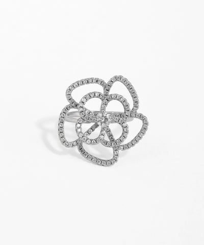 Silver ring with floral design on a white background