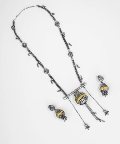 Silver necklace with pendant and matching earrings on a white background