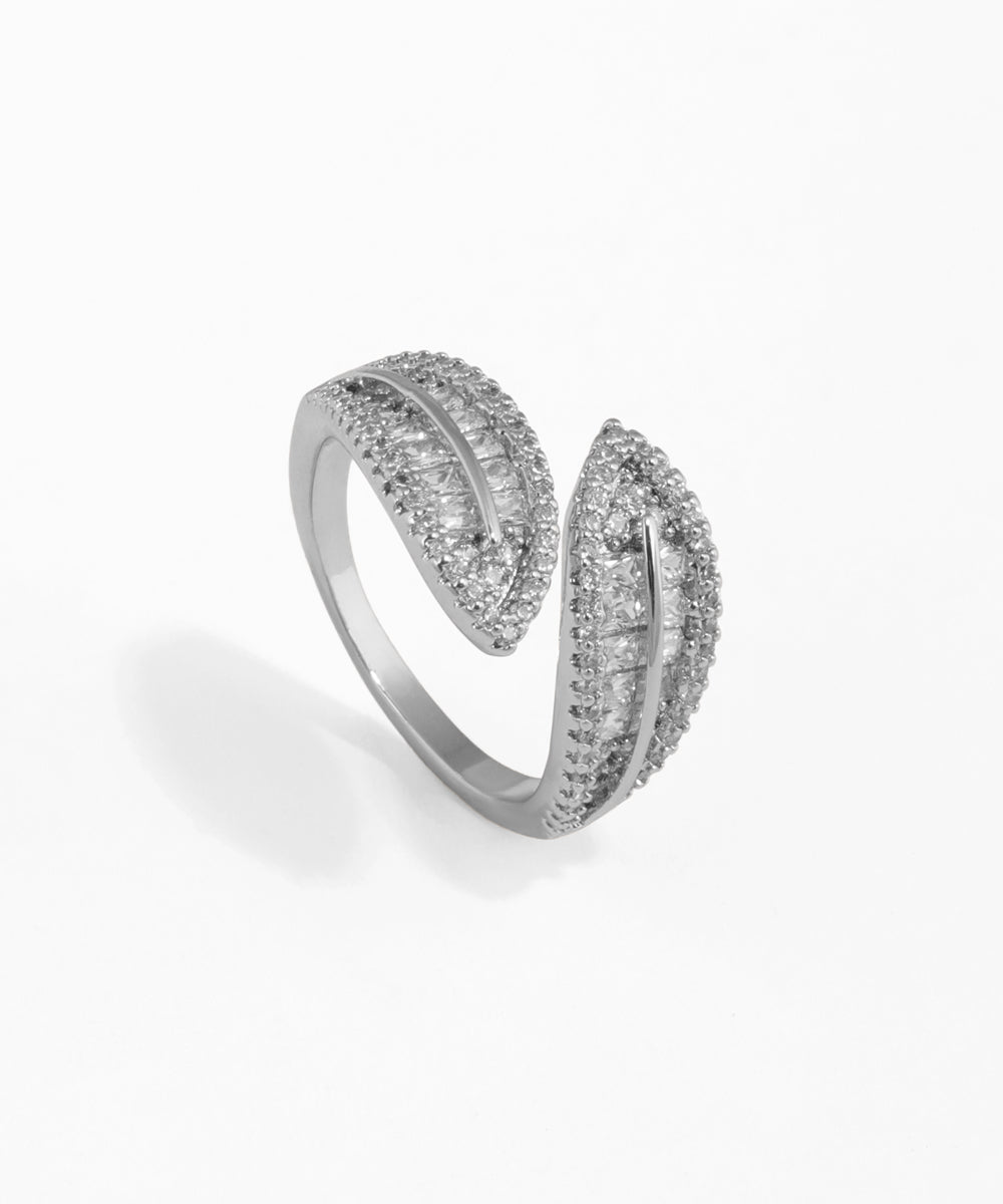 Silver ring with diamond accents on a white background