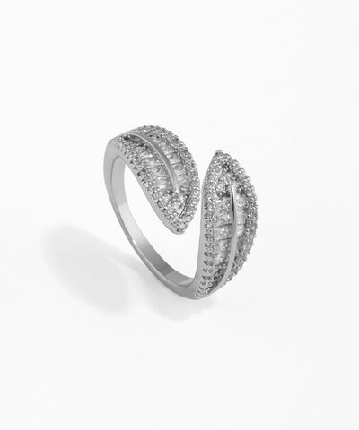 Silver ring with diamond accents on a white background