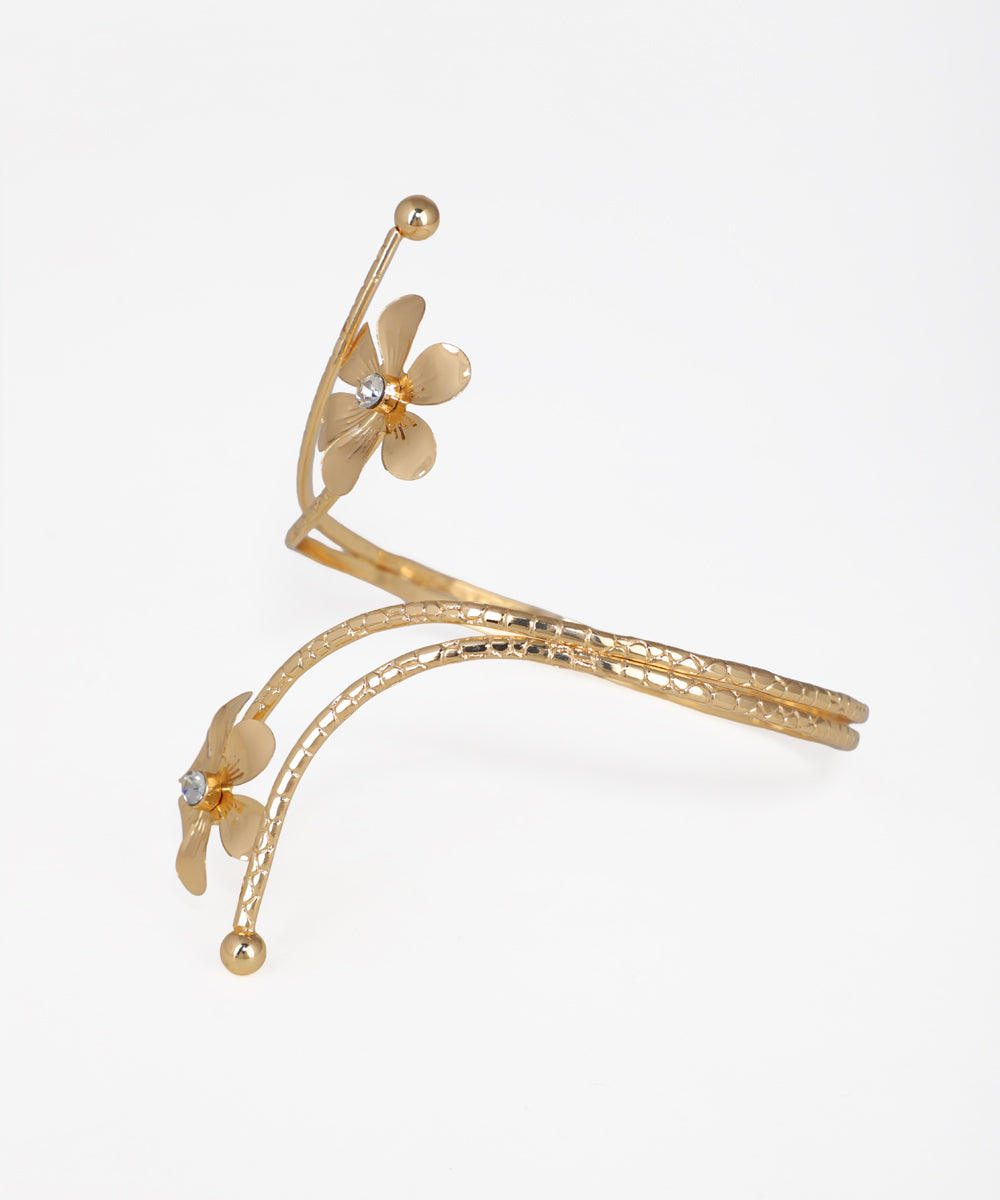 Gold floral hair accessory on a white background