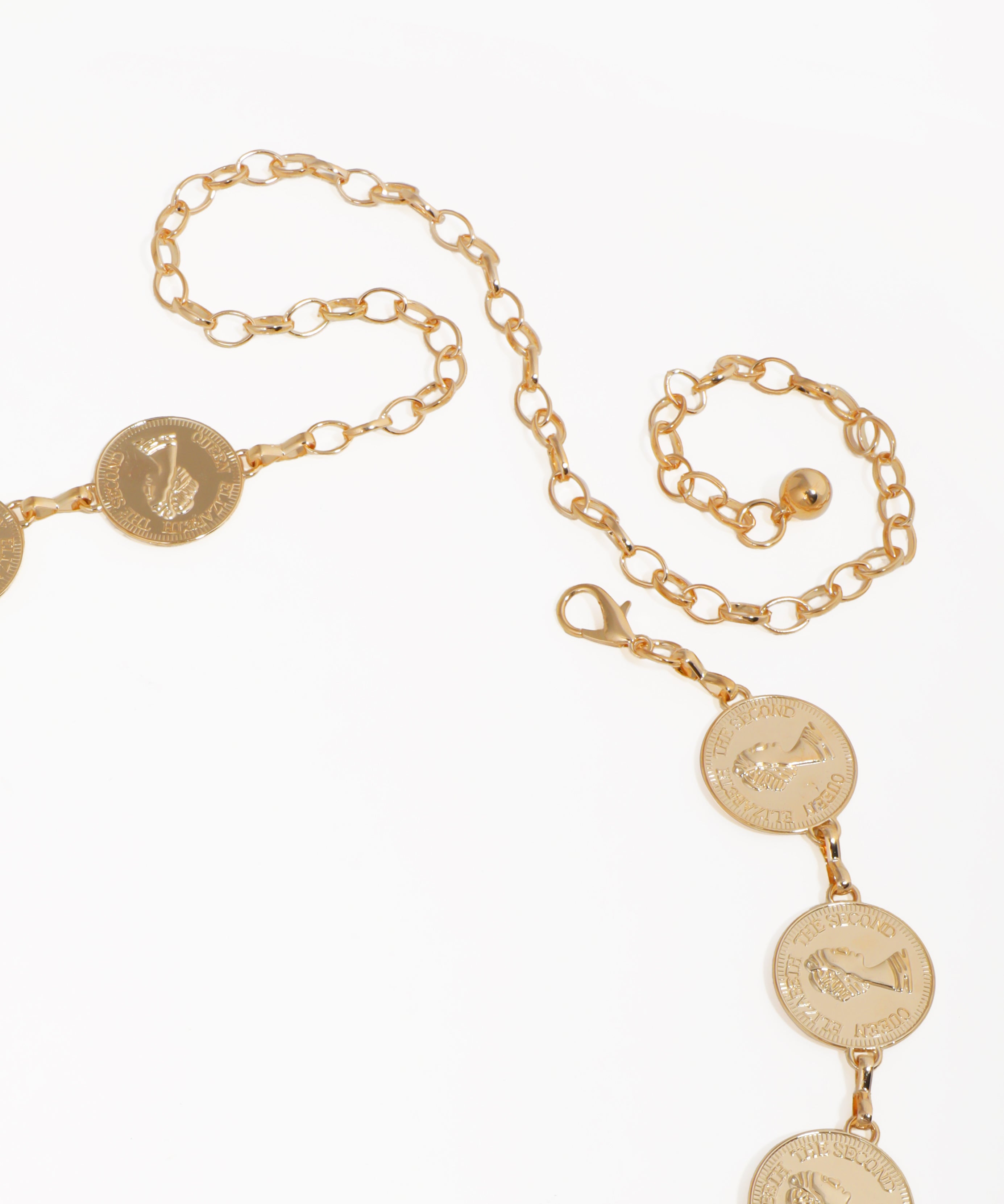 Gold chain necklace with coin pendants on a white background