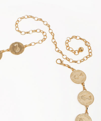 Gold chain necklace with coin pendants on a white background