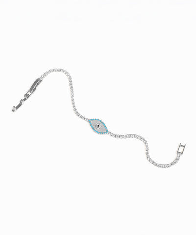 Silver bracelet with a blue evil eye charm on a white background