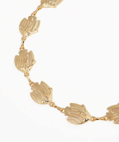 Gold necklace with leaf-like links on a white background