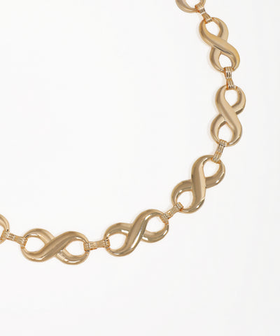 Gold chain necklace on a white background