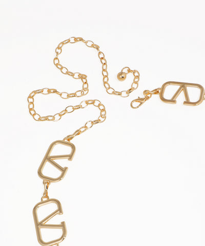 Gold chain with 'LOVE' letters on a white background