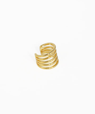 Gold spiral ring on a white background