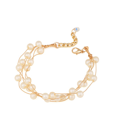 Gold-tone multi-strand bracelet with delicate wire strands and numerous small faux pearls, featuring a lobster clasp.