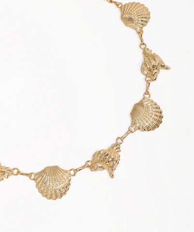 Gold necklace with shell-shaped pendants on a white background