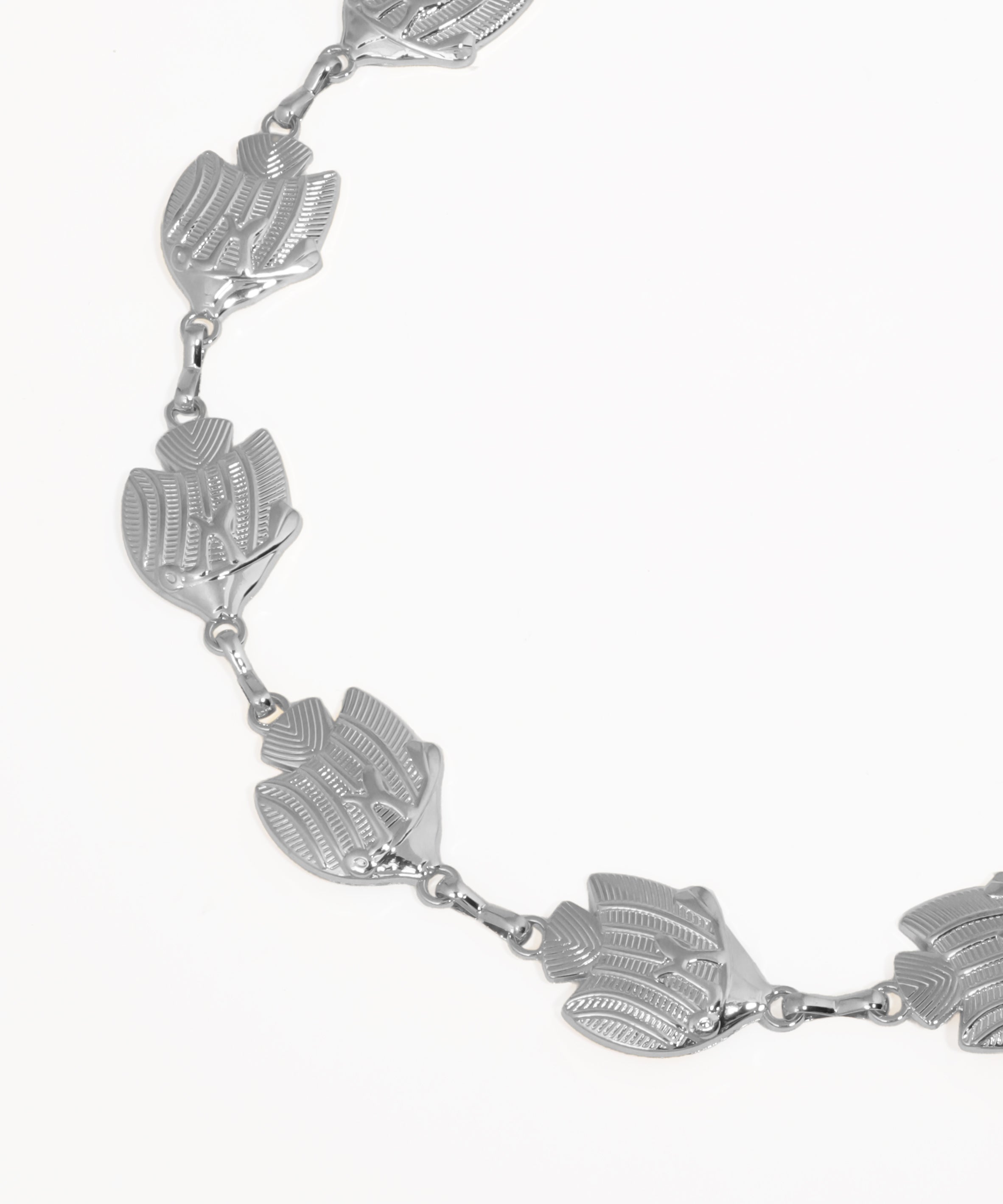 Silver bracelet with leaf-shaped links on a white background