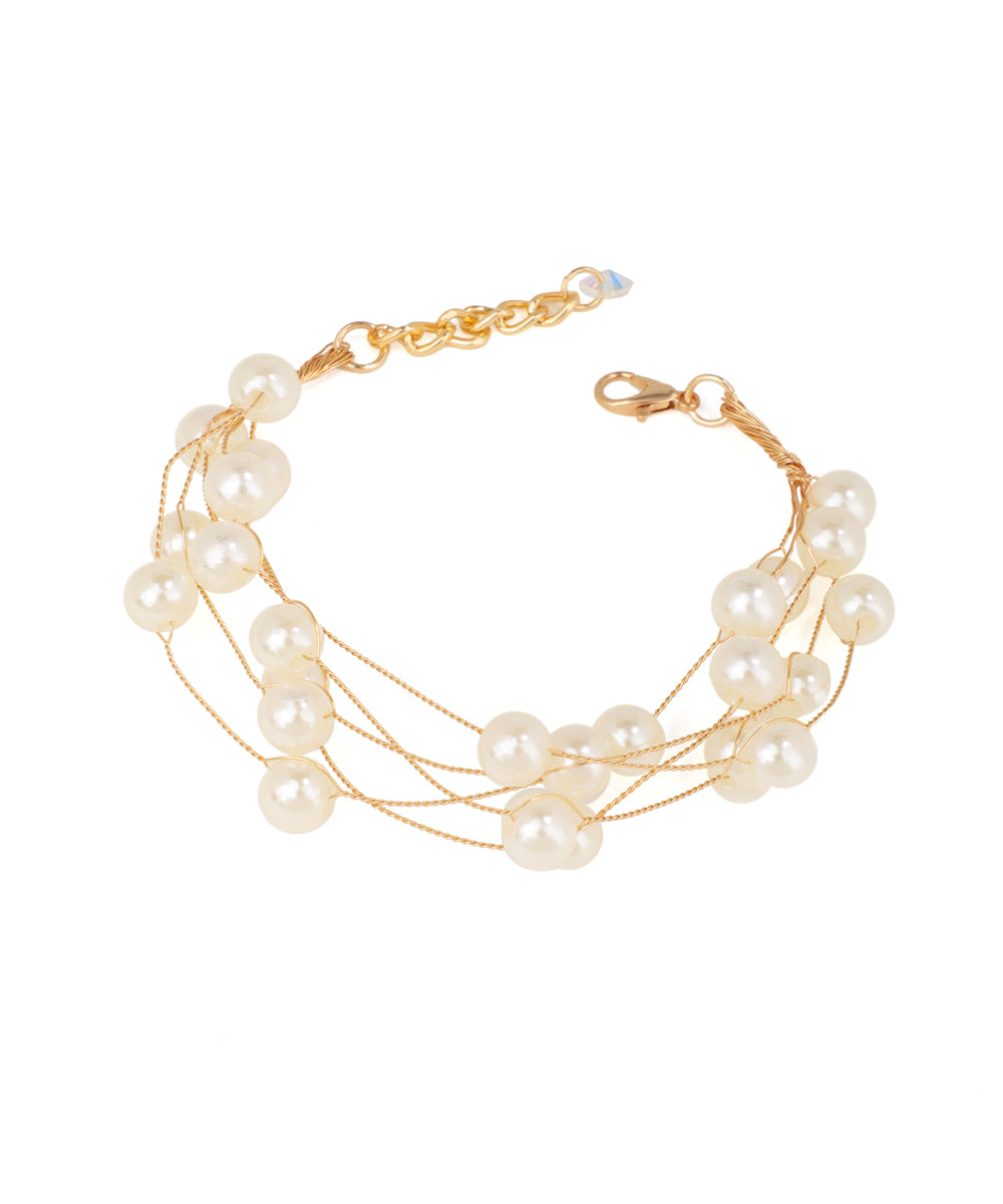 Gold-tone multi-strand bracelet with cream faux pearls and an adjustable closure