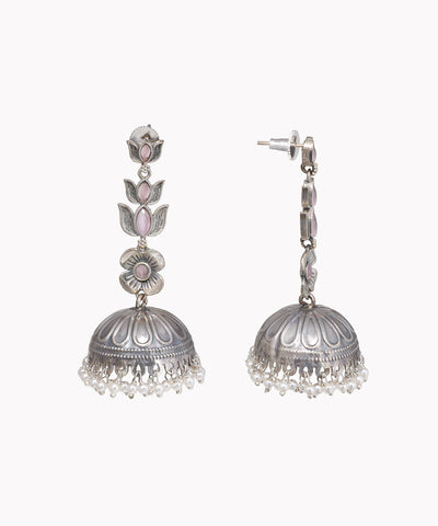 Pair of silver jhumka earrings on a white background