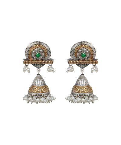 Pair of ornate earrings with gold and silver design on a white background