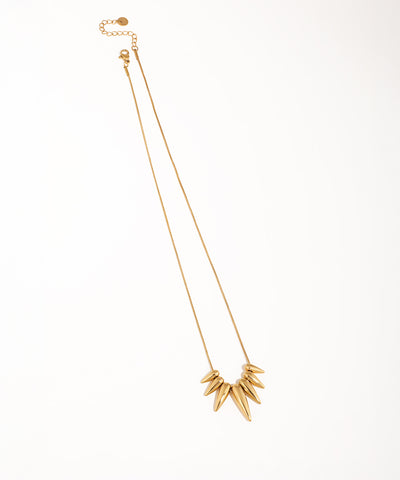 Gold-tone necklace with a cluster of polished geometric pointed drops on a thin chain