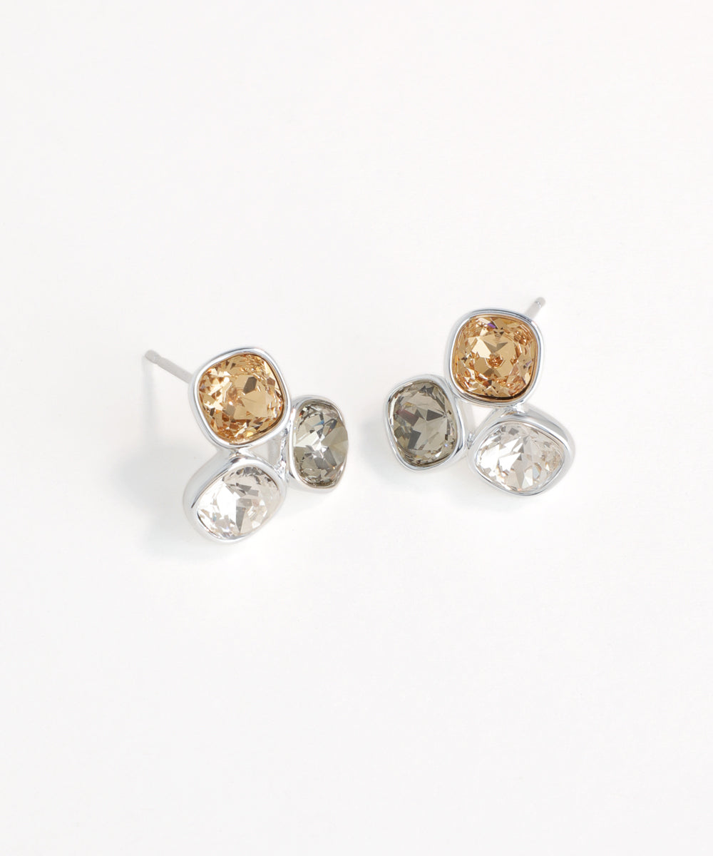 Pair of earrings with multicolored gemstones on a white background