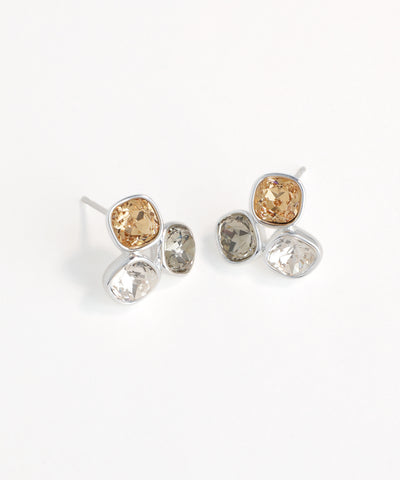 Pair of earrings with multicolored gemstones on a white background
