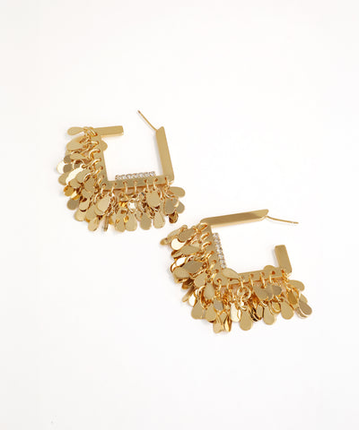 Gold hoop earrings with dangling charms on a white background