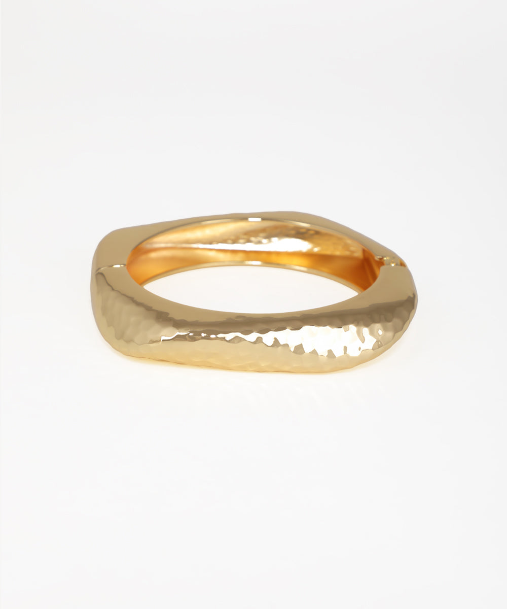 Gold-tone bangle kada with hammered texture and geometric shape