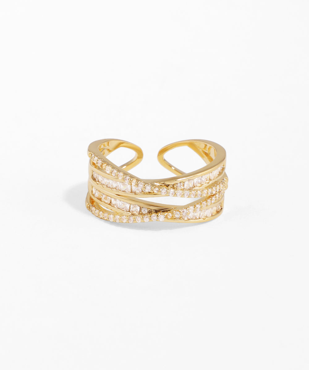 Gold ring with diamond accents on a white background
