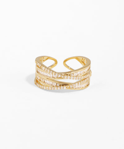 Gold ring with diamond accents on a white background