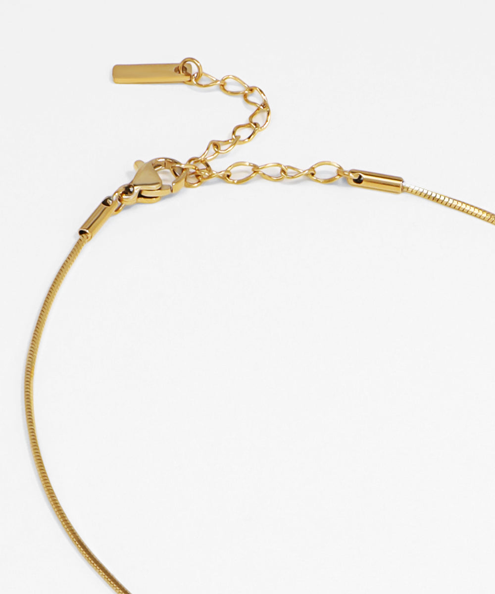 Gold bracelet on a white background