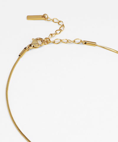 Gold bracelet on a white background