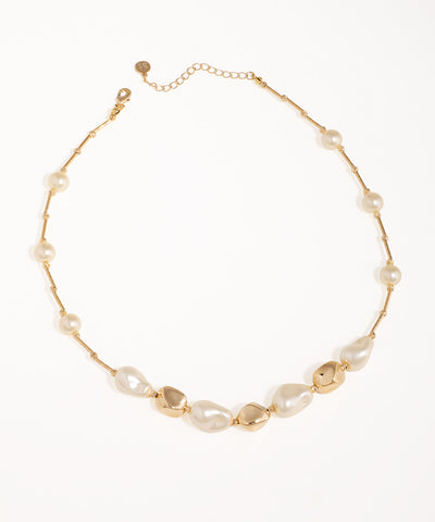 Gold-tone necklace with irregular faux pearls and organic metallic links, featuring a lobster clasp and extender.