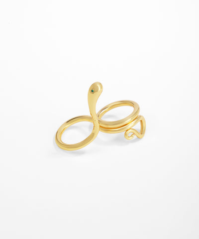 Gold snake-shaped ring on a white background