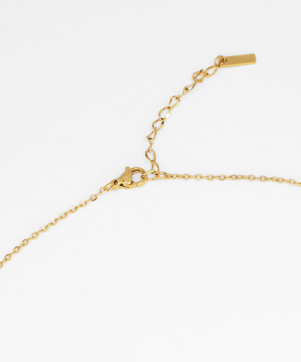 Gold bracelet on a white background