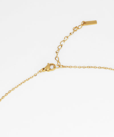 Gold bracelet on a white background