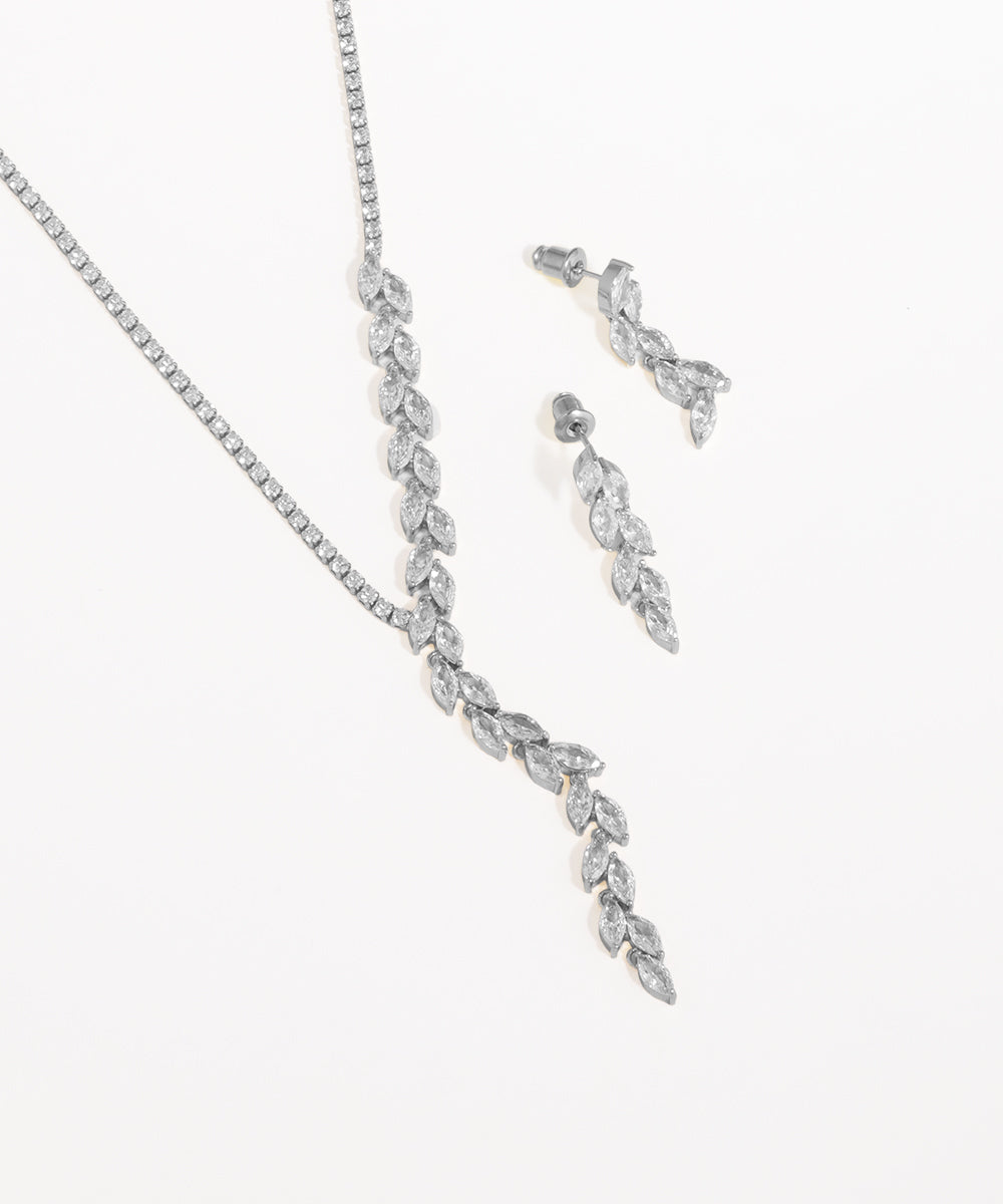 Silver necklace and earrings set on a white background