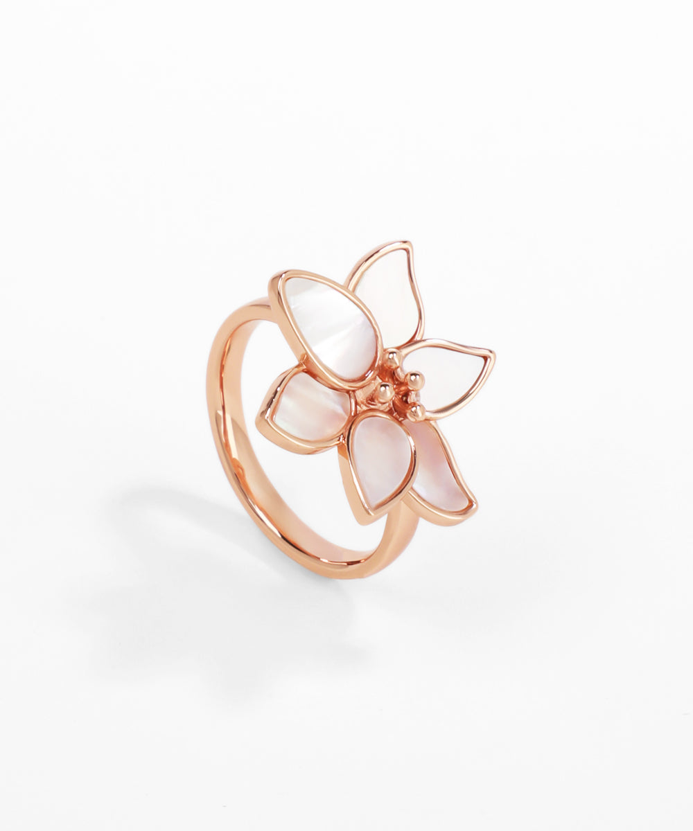 Rose gold ring with butterfly design on a white background