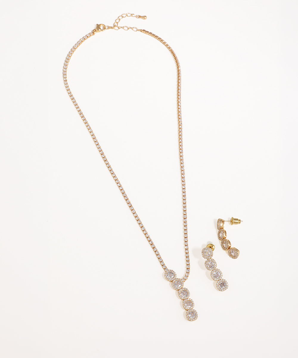 Gold-tone necklace and earring set with shimmering tennis chain and round CZ halo drops.