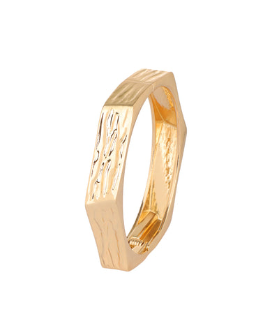 A gold hexagonal ring with a textured, hammered finish on the exterior and a polished interior, shown on a plain white background.