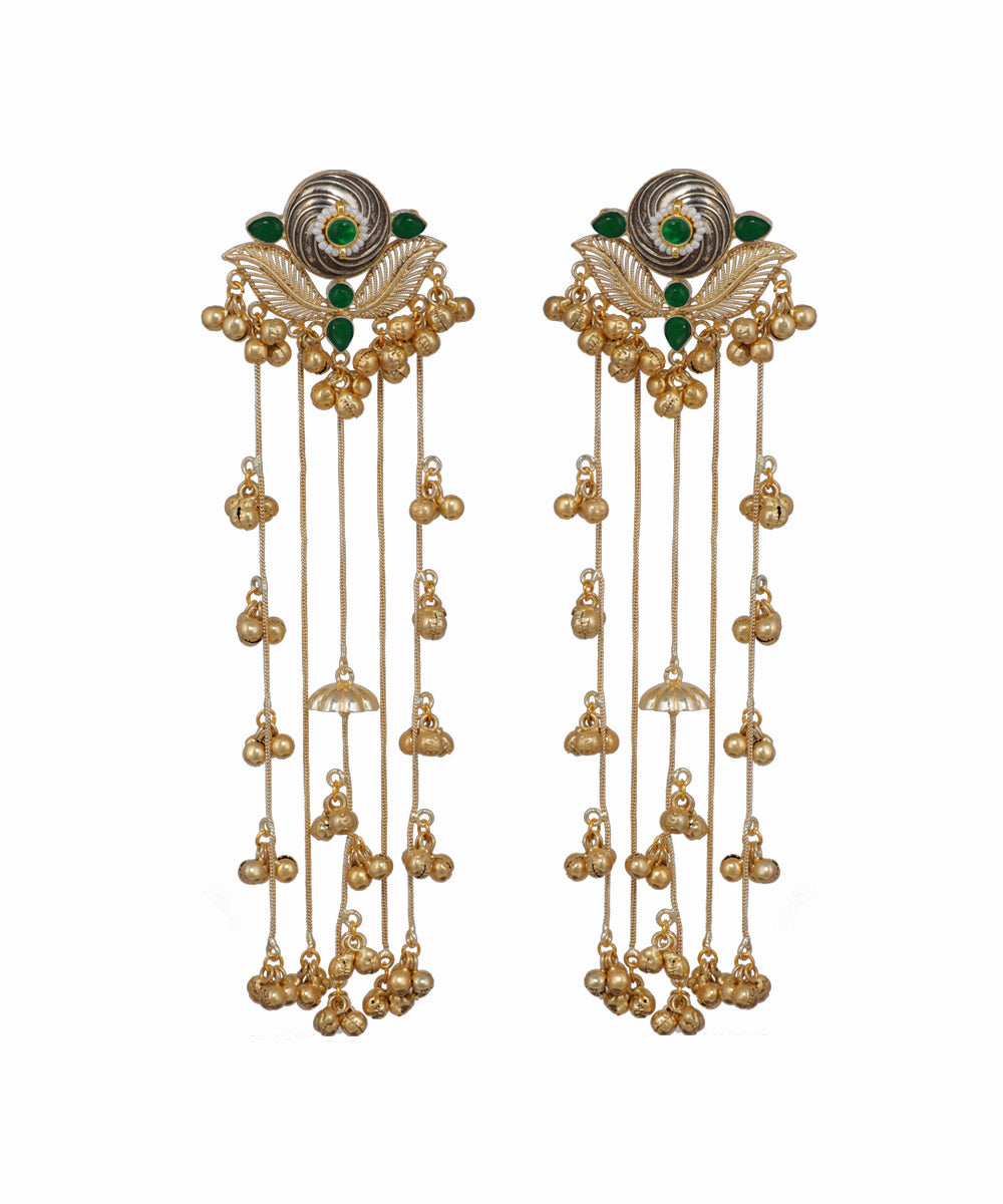 Pair of gold earrings with green gemstones on a white background