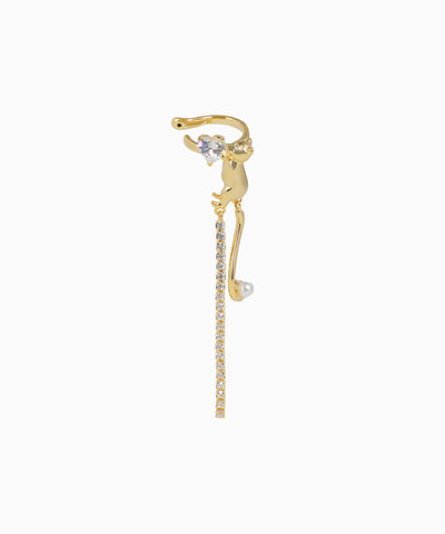 Gold cat-shaped earring with a small pearl on a white background