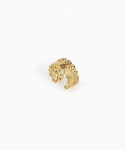 Gold-tone ear cuff with hexagonal grid pattern and clear stones