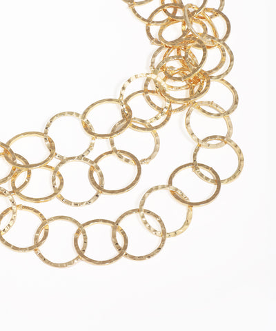 Gold chain necklace on a white background