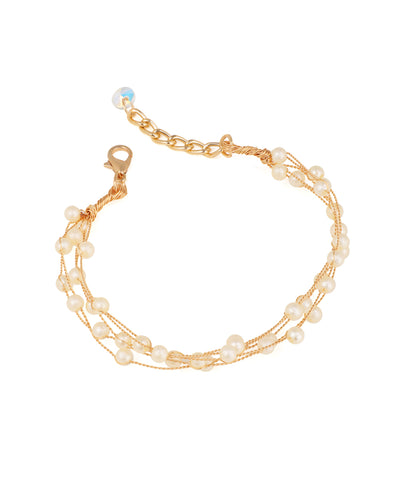 Gold-tone multi-strand bracelet with faux pearls and an iridescent bead on extender chain.