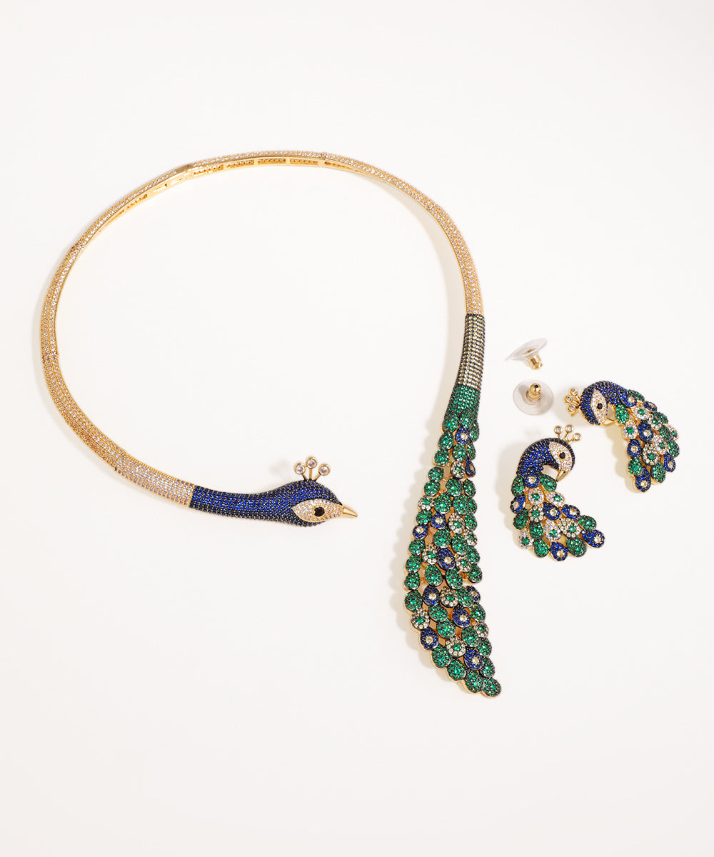 Gold-tone necklace and drop earrings set with blue, green, and clear CZ stones in an elaborate peacock design.