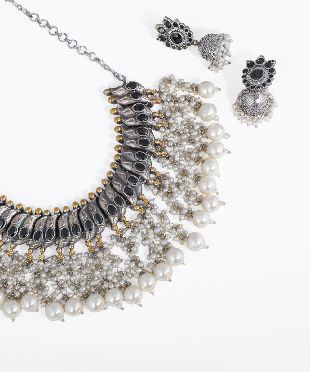 Jewelry set with necklace and earrings on a white background